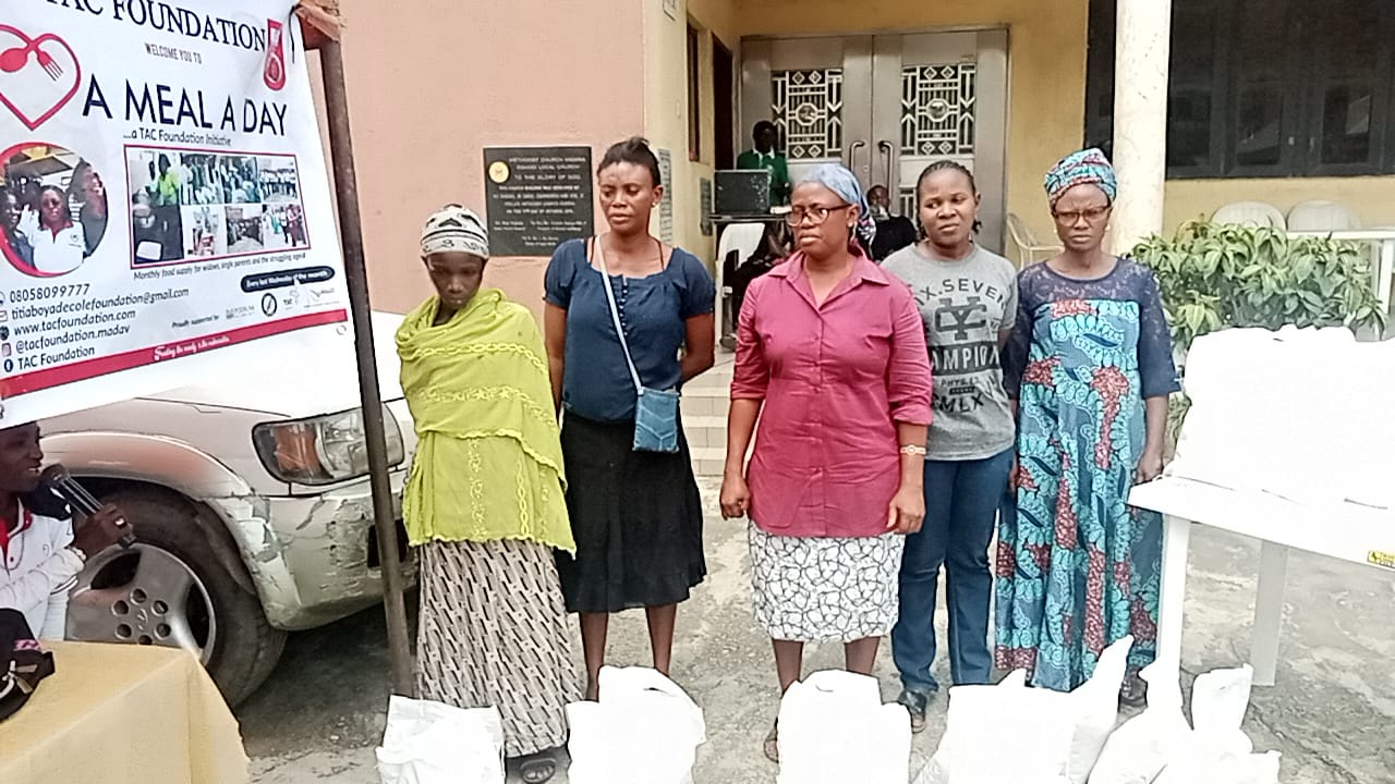 Women receiving monthly food support at an A Meal A Day distribution
